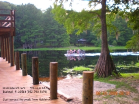 Boating down the Withlacoochee River at the Riverside RV Park two level fishing dock.